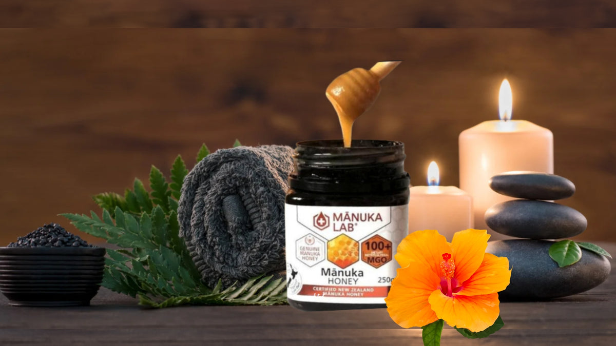 Manuka honey is spooned from an opaque black jar